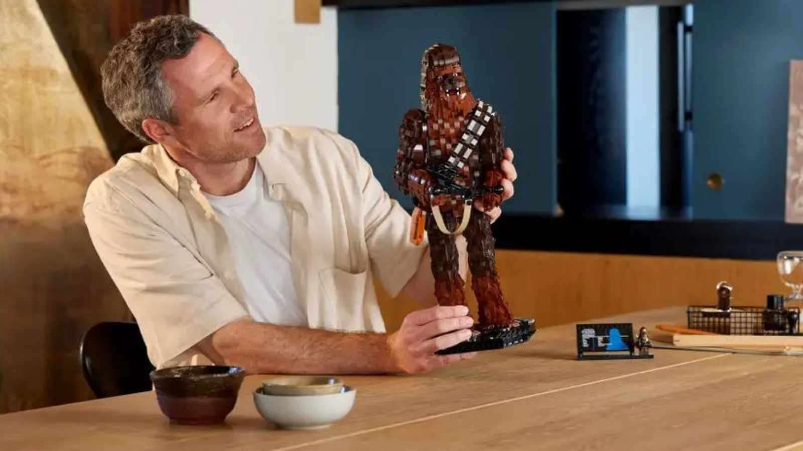 An adult with their LEGO Star Wars Chewbacca set