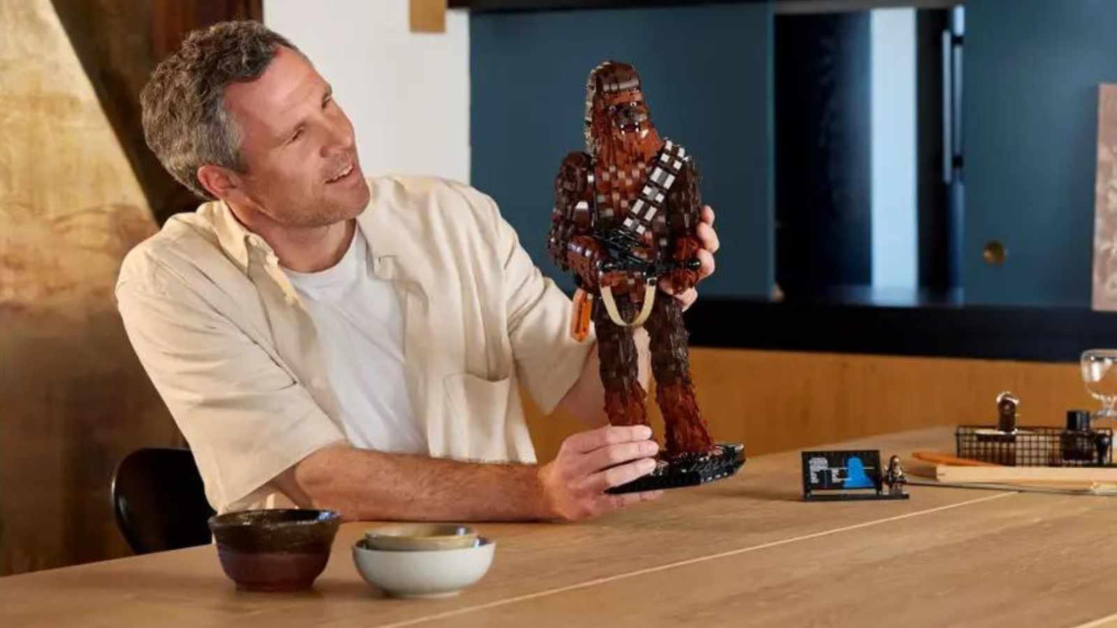 An adult with their LEGO Star Wars Chewbacca set