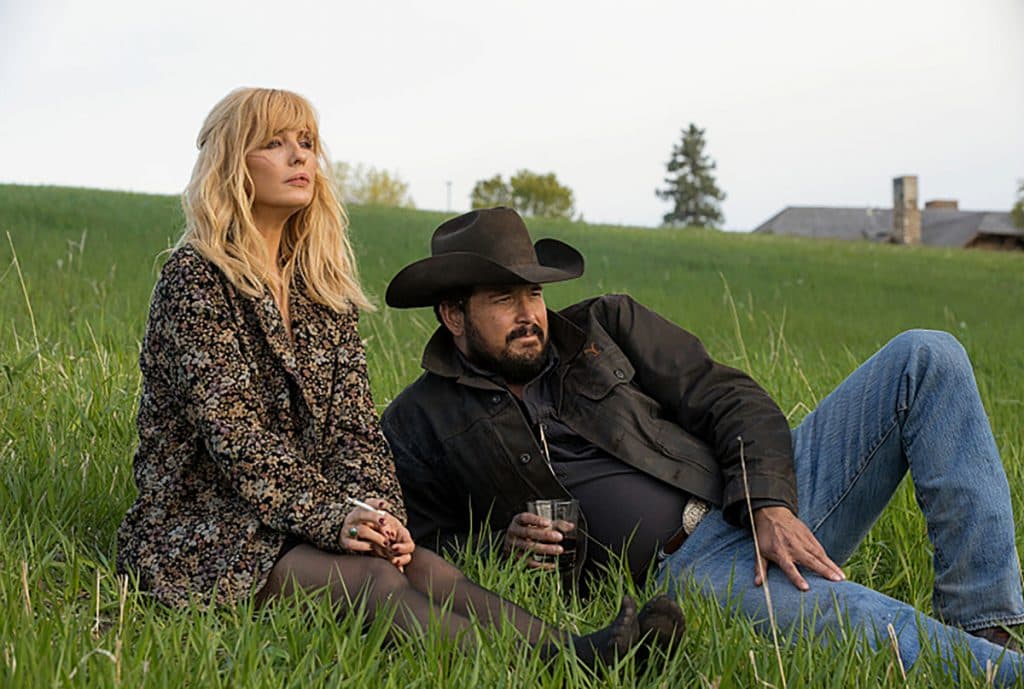 Yellowstone seasons ranked by Rotten Tomatoes scores: Beth and Rip laying on the grass