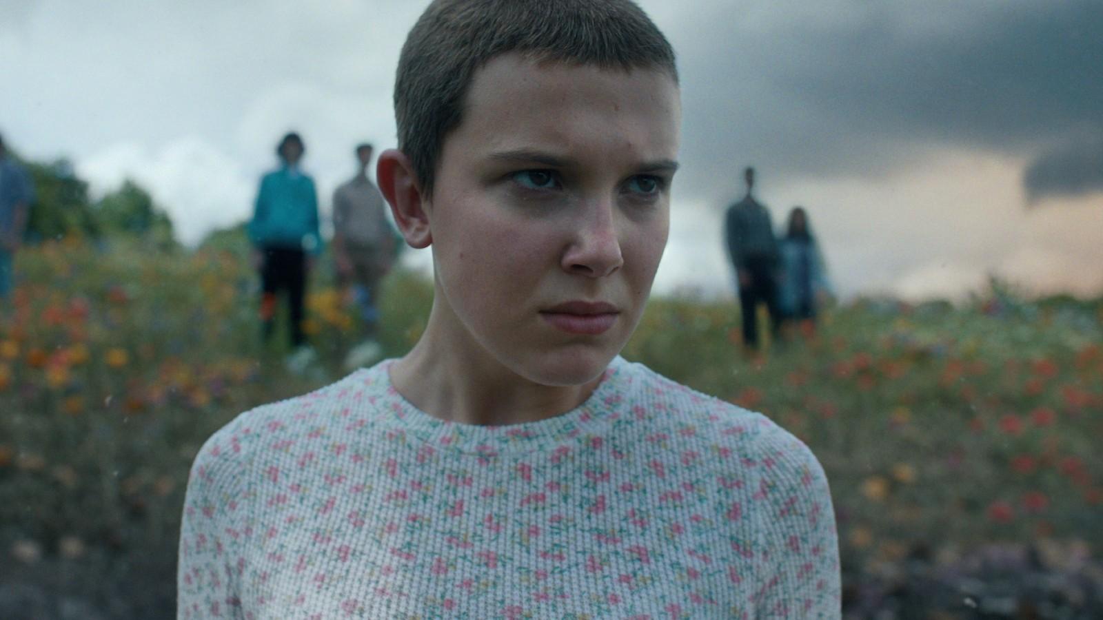Millie Bobby Brown - with shaved head - as Eleven in Stranger Things.