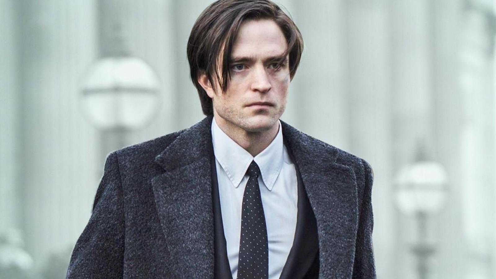 Robert Pattinson in a suit as Bruce Wayne in The Batman.