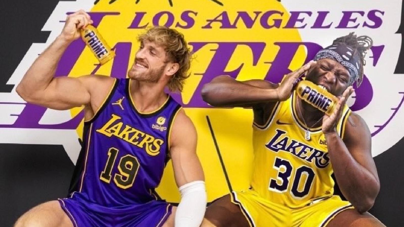 Logan Paul and KSI holding Prime bottle in front of LA Lakers sign