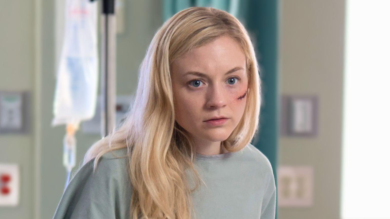 Beth Greene stands in a hospital room wearing a gown in The Walking Dead season 5 episode 8. She has a large cut on the side of her face.