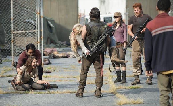 Daryl carrying Beth approaches Maggie and Glenn in The Walking Dead season 5 episode 8.