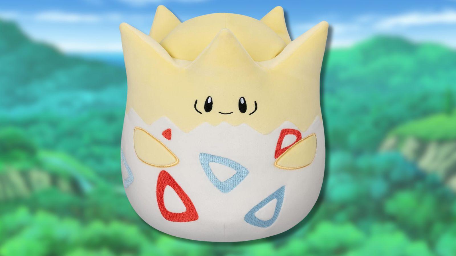 Togepi Squishmallow with forest background.