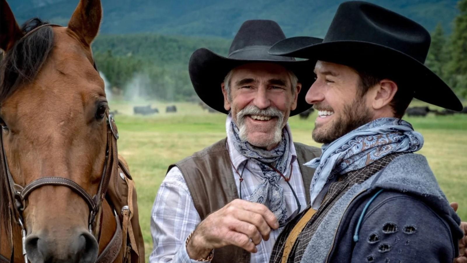 Lloyd and Ryan in Yellowstone, laughing while standing next to a horse