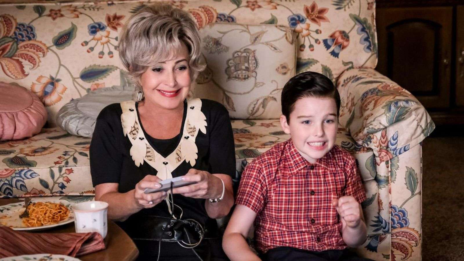 Meemaw and Sheldon playing video games on the floor in Young Sheldon.