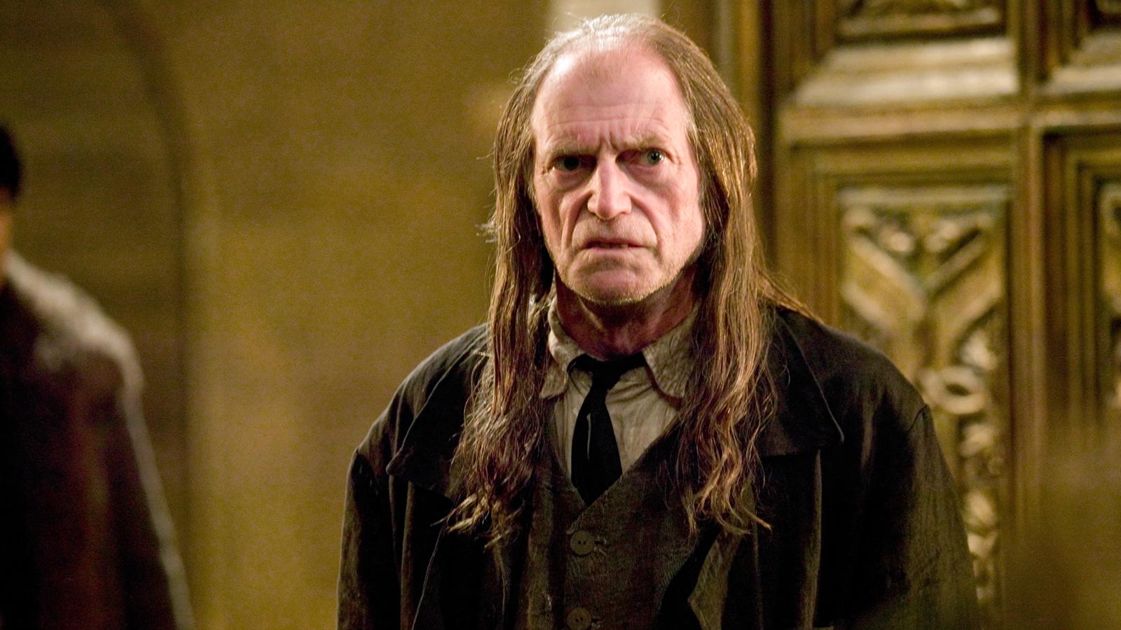 David Bradley as Argus Filch in Harry Potter franchise.