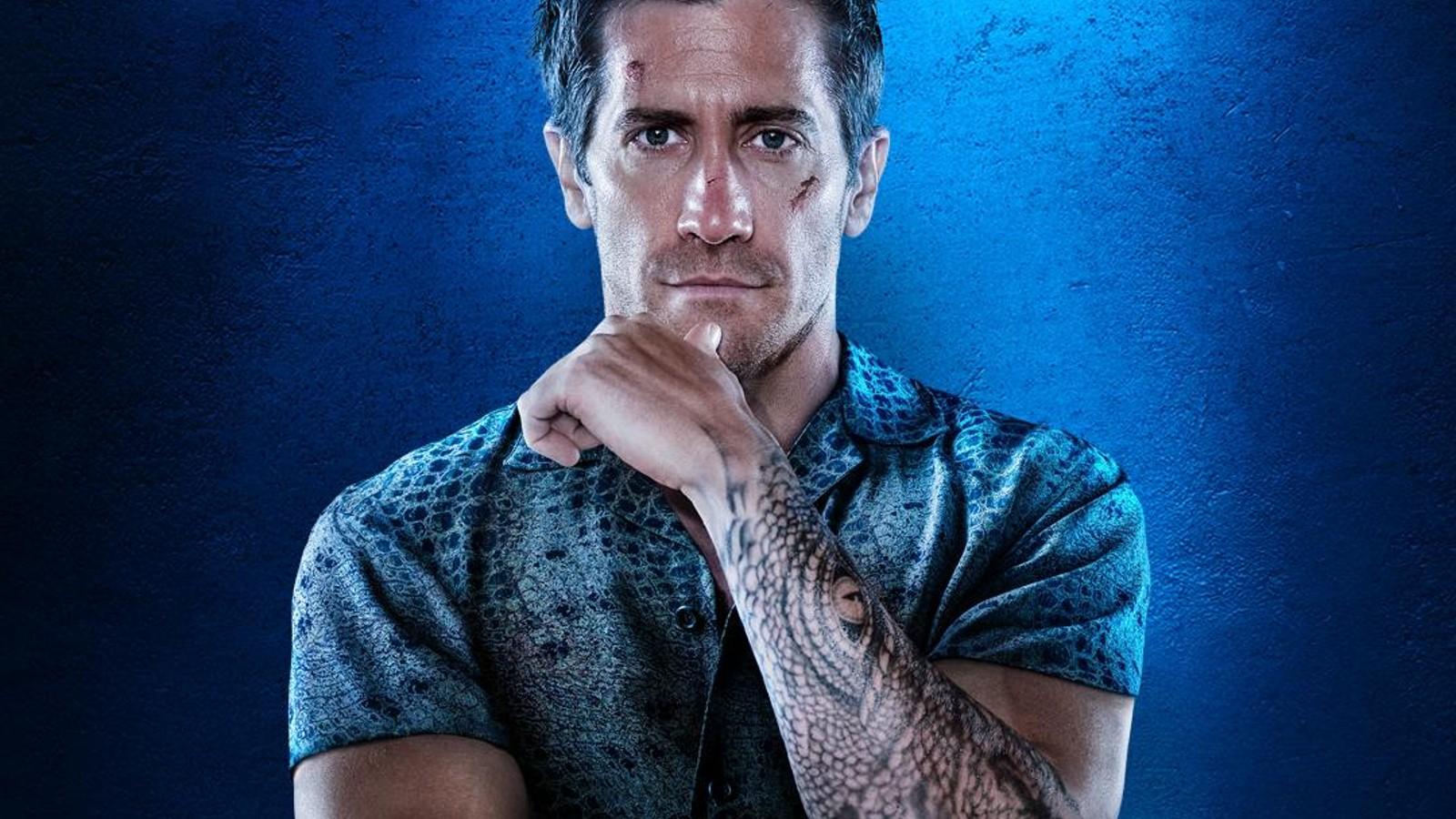 Jake Gyllenhaal with arms folded on the Road House poster.