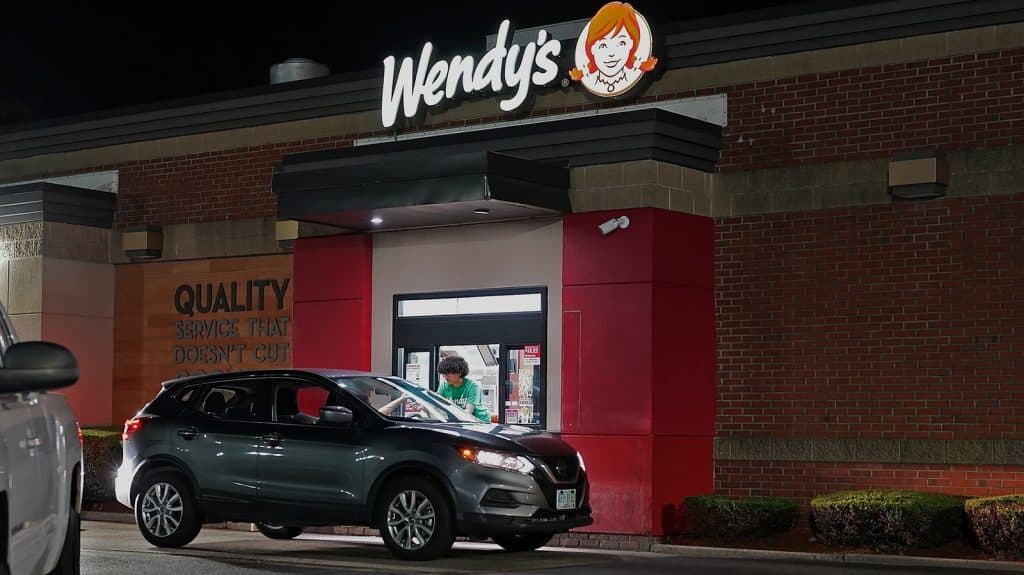 A Wendy's drive-thru at night.