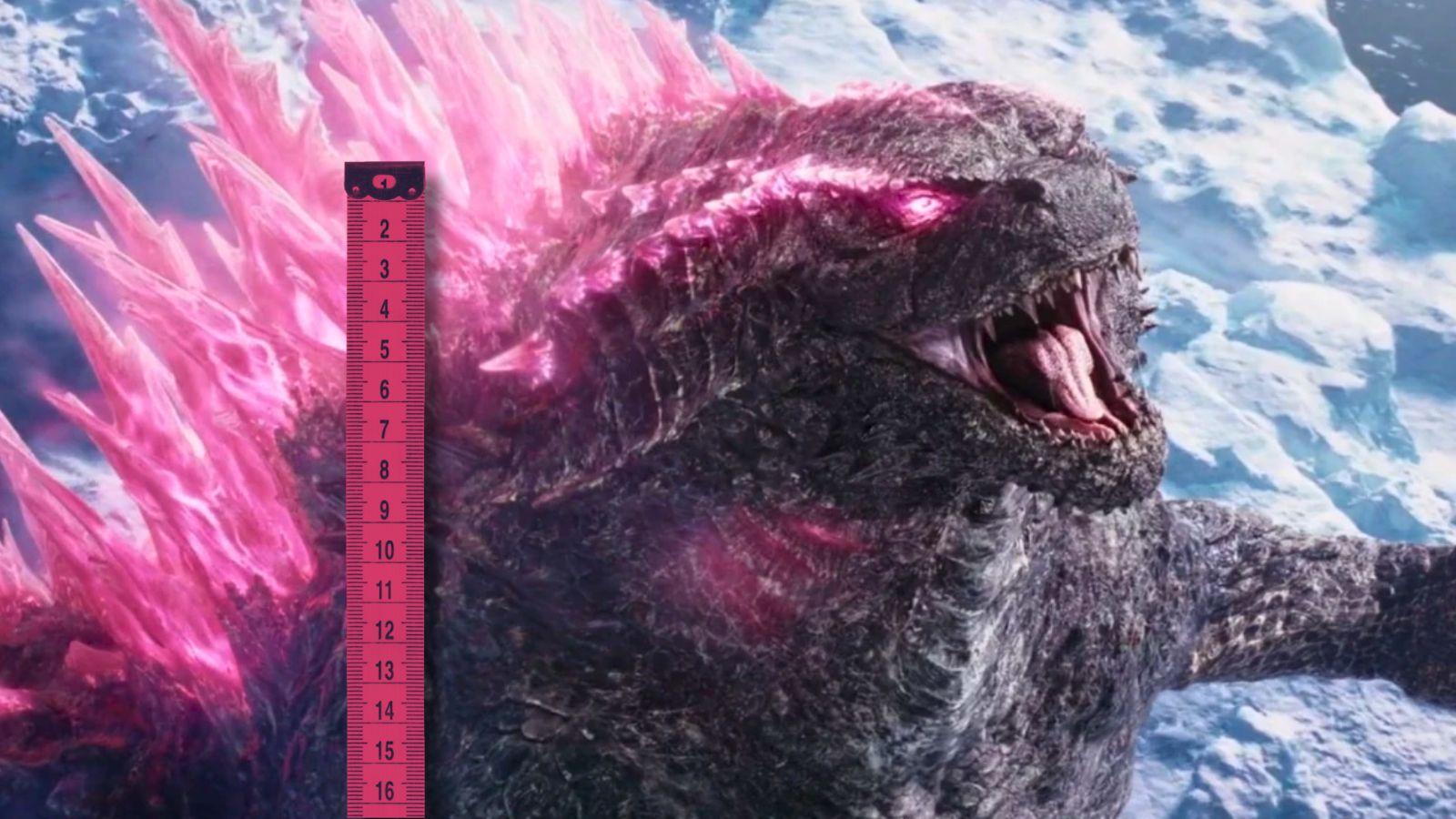Godzilla roaring at the sky while standing next to a pink measuring tape