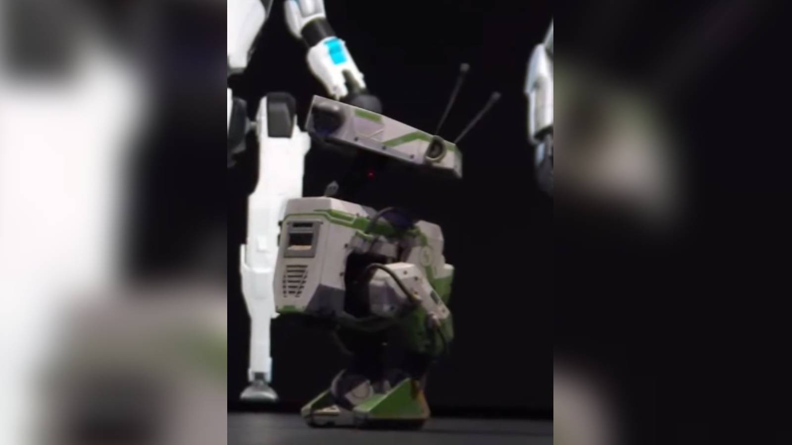 Screenshot of the cnetdotcom footage of Jensen Huang's keynote at GTC 2024, featuring the green BD-X Star Wars droid.