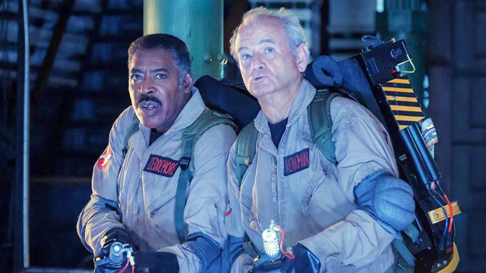 Venkman and Winston in Ghostbusters Frozen Empire. They stand in-uniform wearing proton packs.