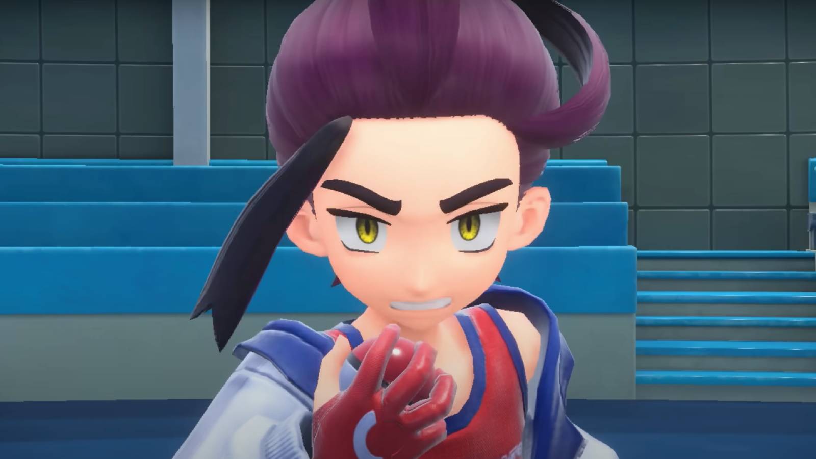 Pokemon Scarlet and Violet trainer Kieran looks determined, clenching their fist