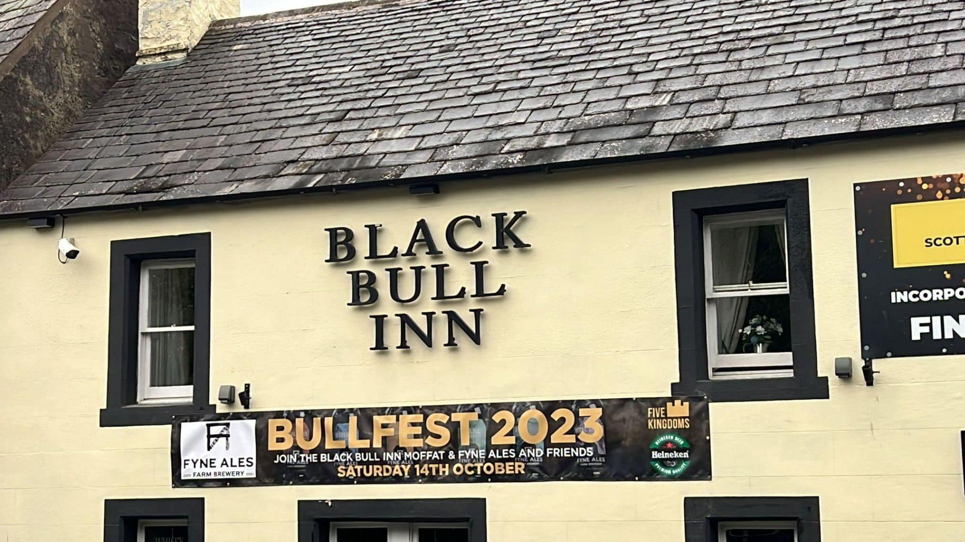 Sign and outside of Black Bull in pub in Moffatt, Scotland