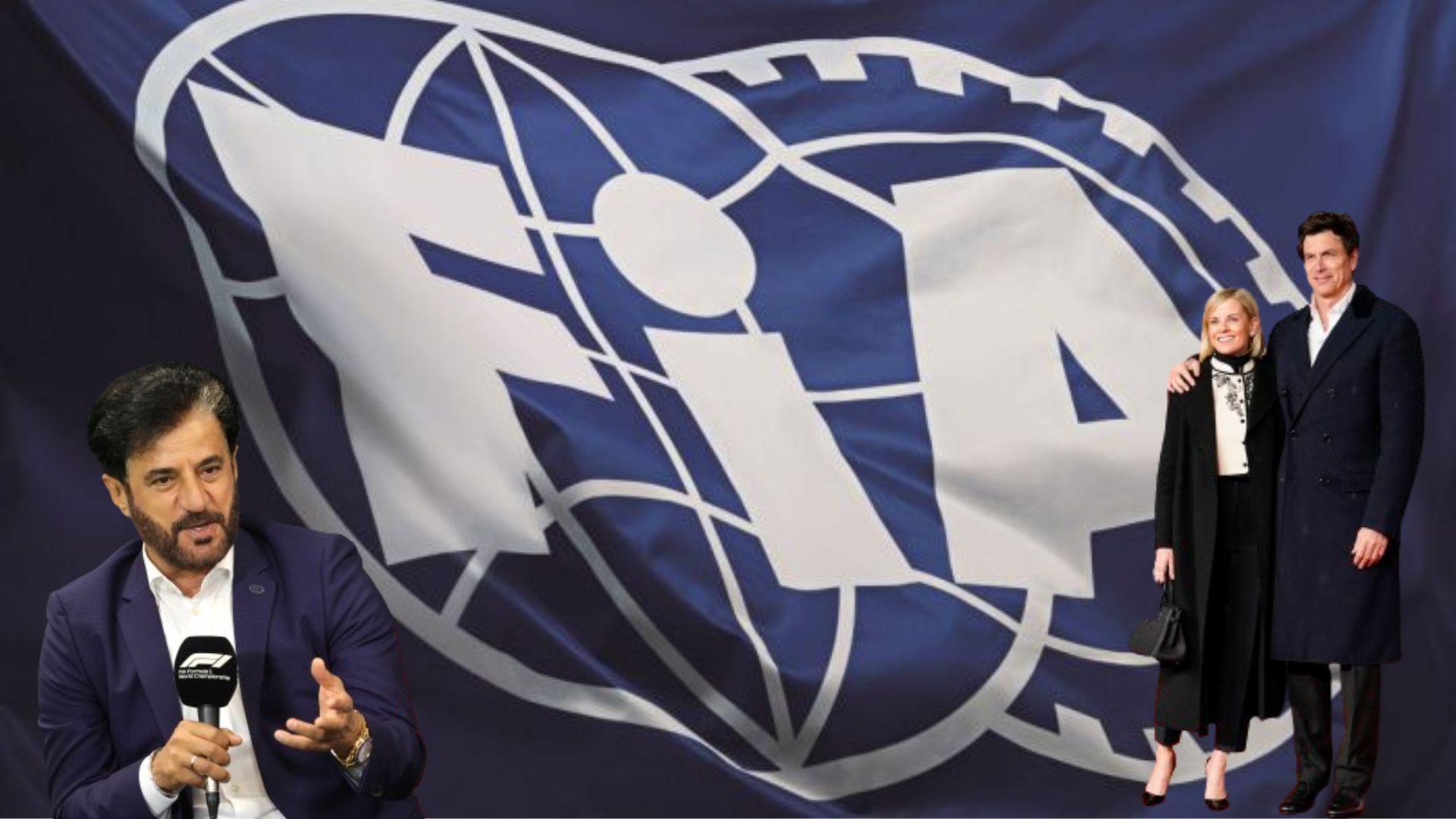Susie Wolff, Toto Wolff and FIA president Mohammed Ben Sulayem in front of an FIA flag