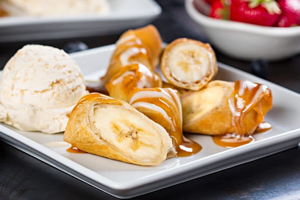 A photo of banana spring rolls with ice cream