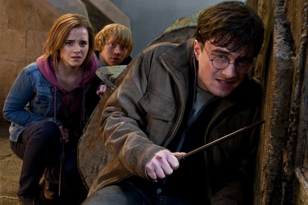 Harry Potter scene including Harry, Hermione, and Ron hiding