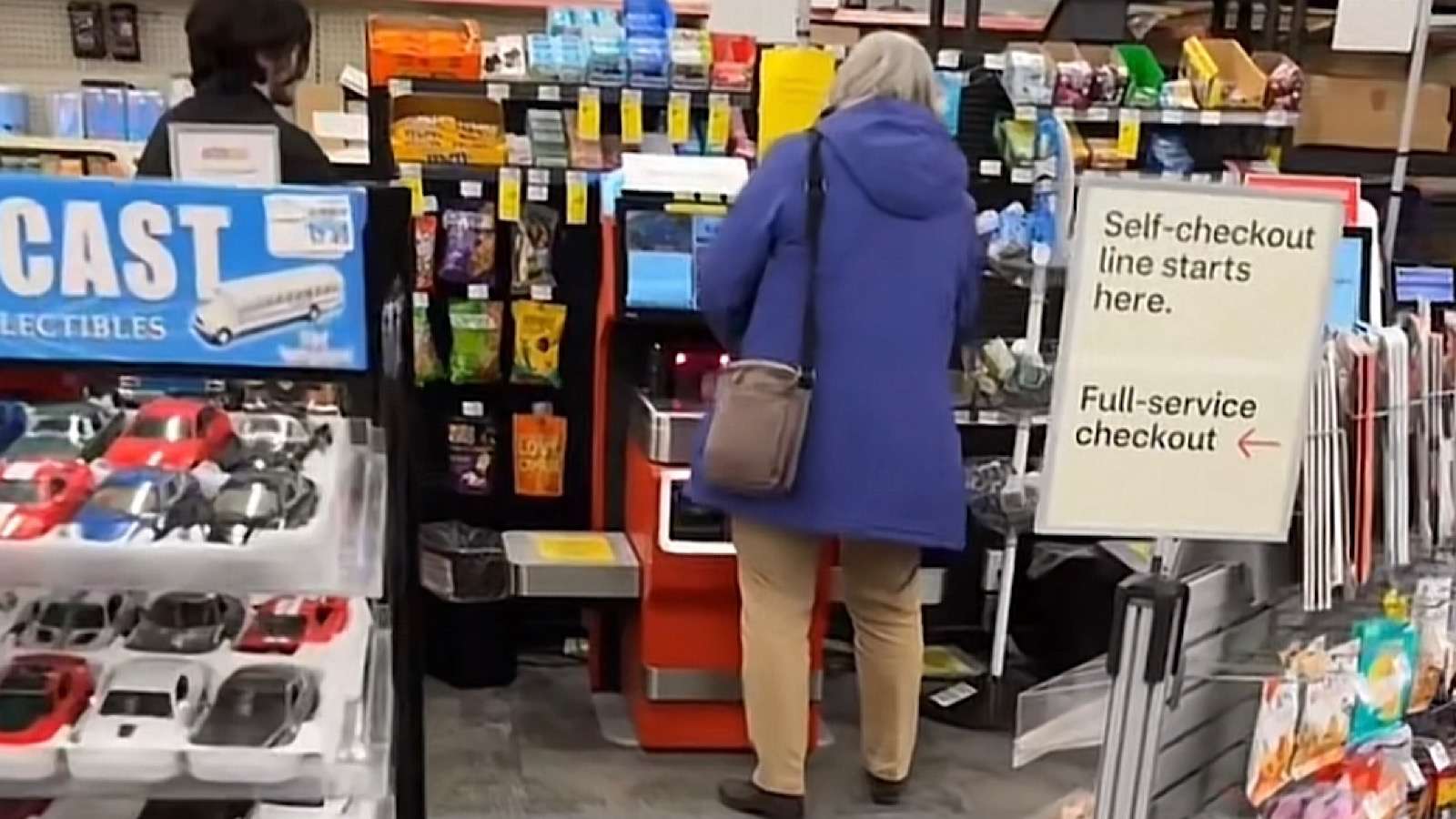 elderly woman screams at self checkout machine