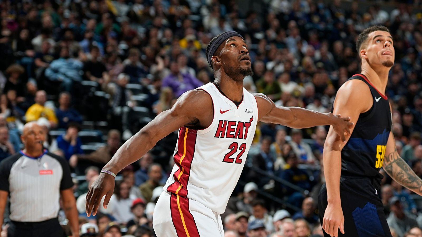 Jimmy Butler as a member of the Miami Heat (left) playing against Michael Porter Jr. as a member of the Denver Nuggets (right) in the 2023-24 NBA season.