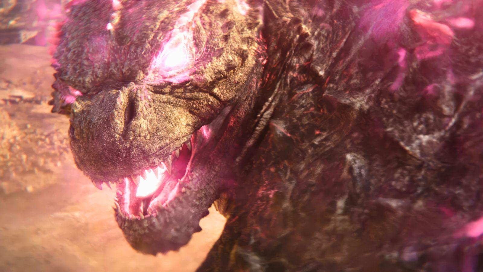 Godzilla in Godzilla x Kong: The New Empire. He turns to face the camera with pink glowing eyes and a mouth.