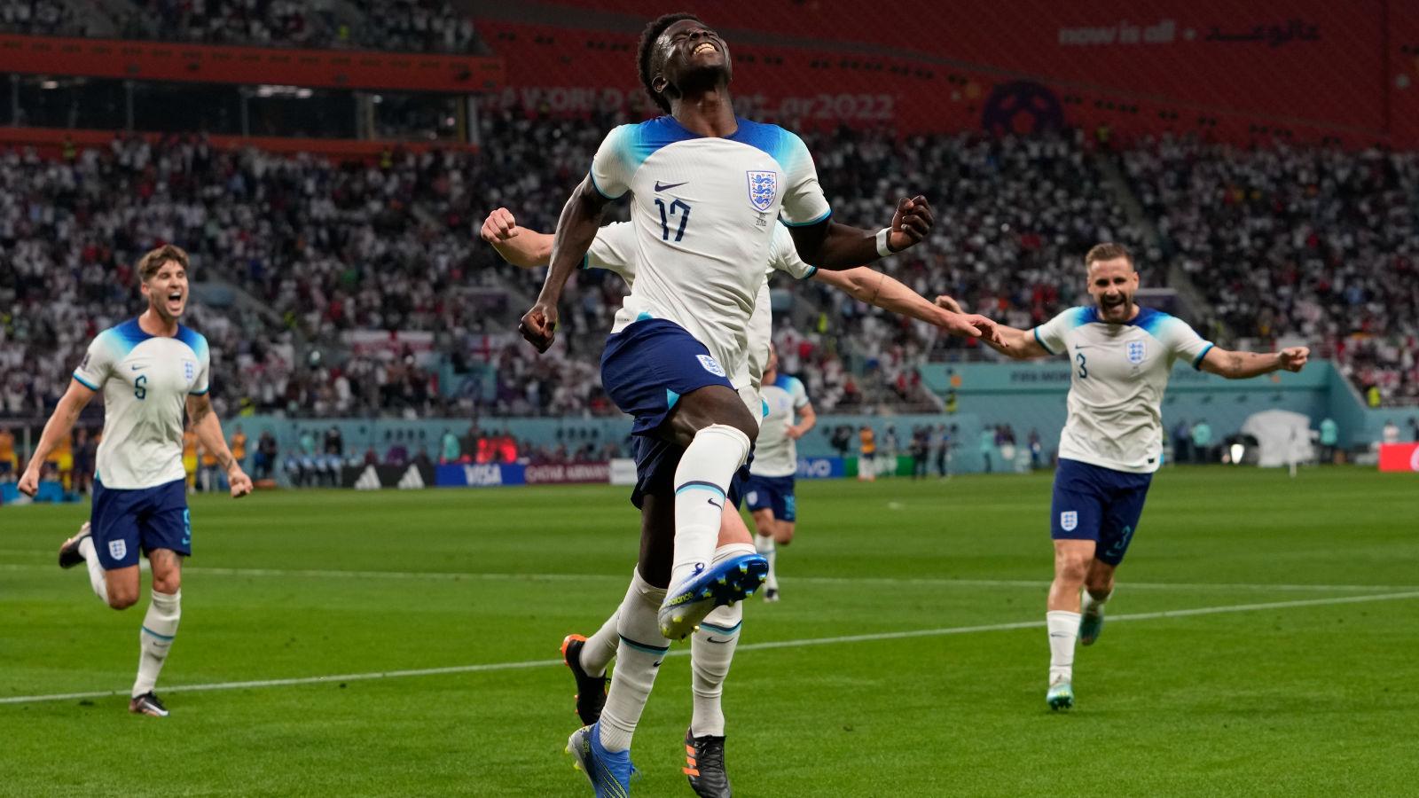 Bukayo Saka celebrates for England