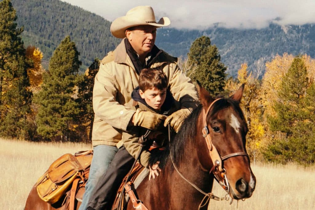 Kevin Costner and Brecken Merrill as John Dutton and Tate in Yellowstone