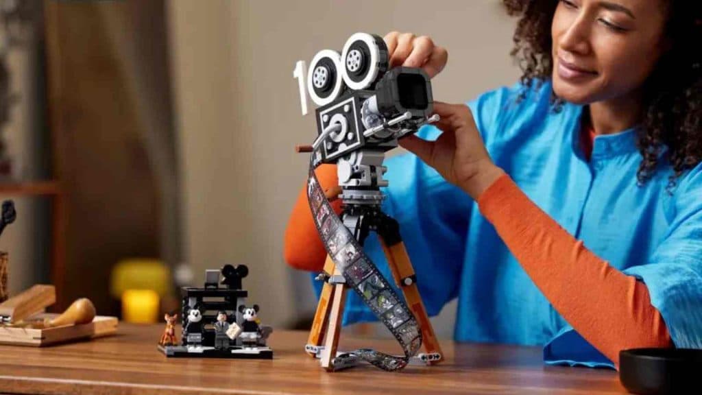 An adult with their LEGO Disney Walt Disney Tribute Camera
