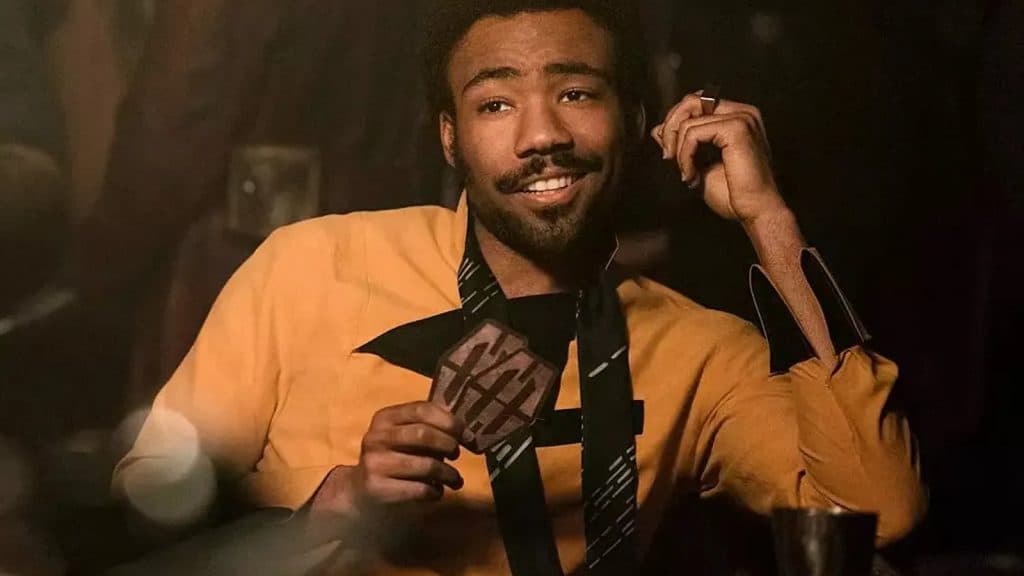 Donald Glover playing cards as Lando in Solo.