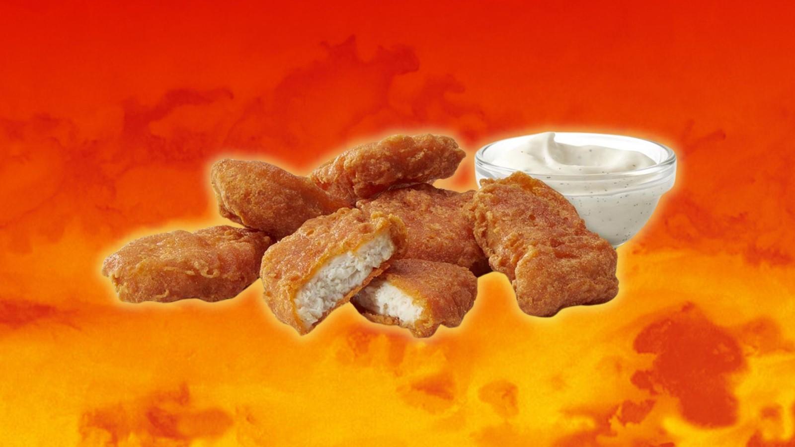 McDonald's spicy McNuggets on a fiery background.