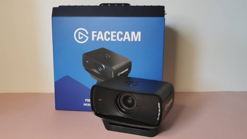 Image of the Elgato Facecam MK.2 and it's box, on a pink covered table.