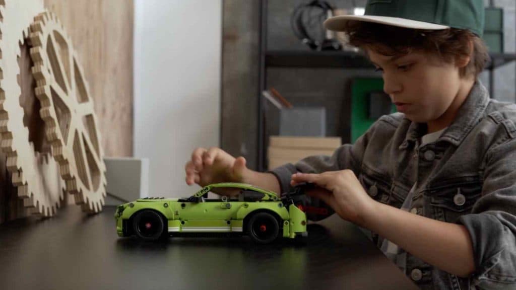 A child with their LEGO Technic Ford Mustang Shelby
