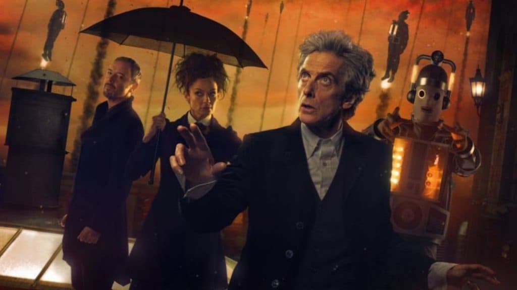 The 12th Doctor in The Doctor Falls with the Master and Missy in the background.