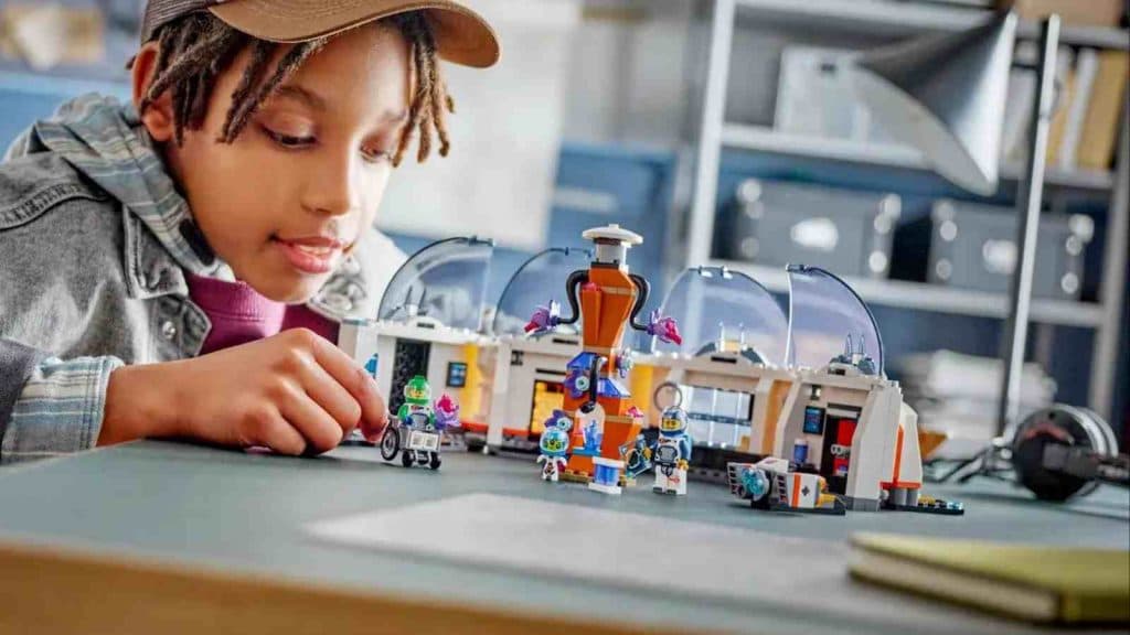A child playing with their LEGO City Space Science Lab set