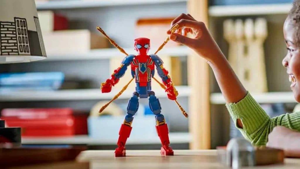 A child with their LEGO Marvel Iron Spider-Man Construction Figure