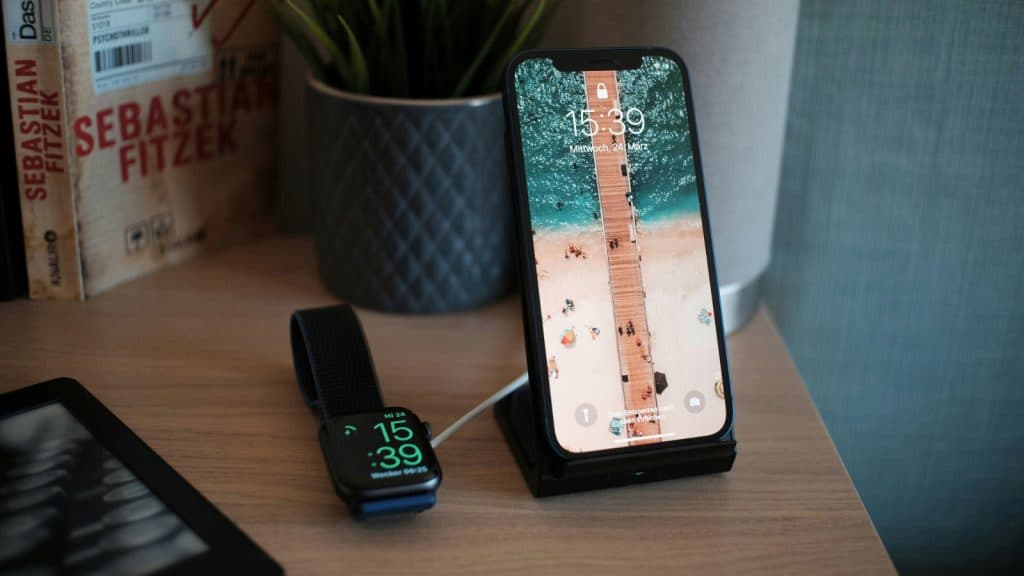 Apple Watch charging next to an iPhone