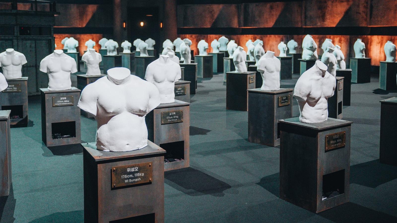 Physical 100 Season 2 plaster busts of contestants.