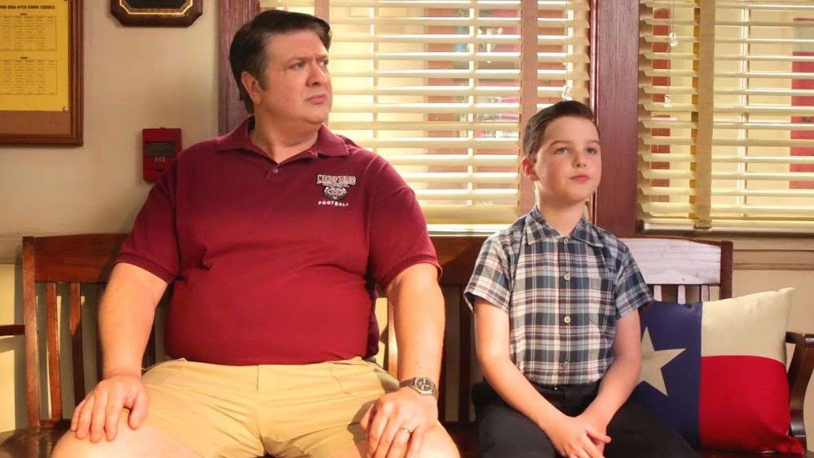Sheldon and George Cooper sitting on a bench in Young Sheldon