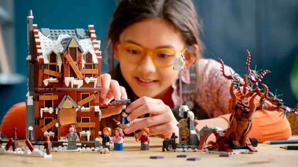 A child with their LEGO Harry Potter The Shrieking Shack & Whomping Willow set
