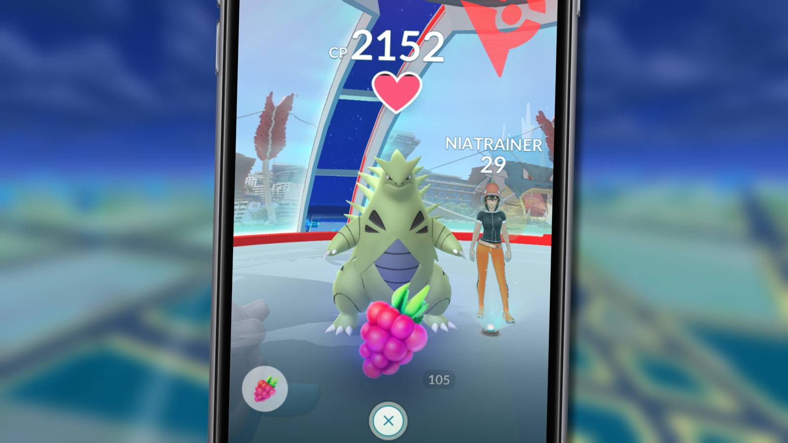 A mobile phone is visible with Pokemon Go on the screen