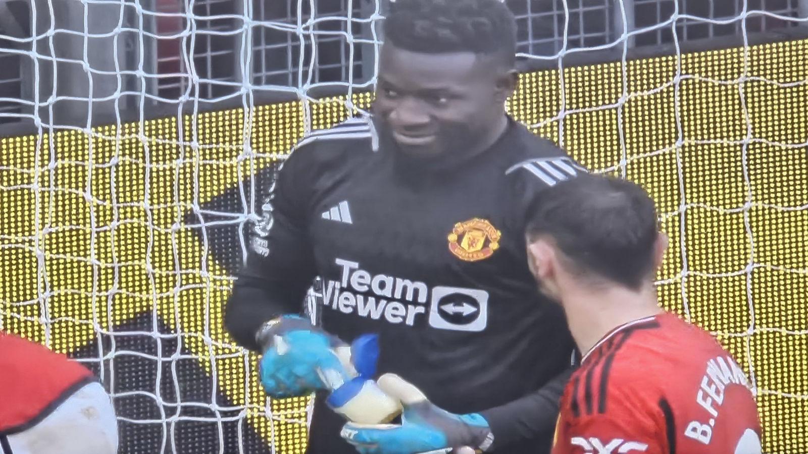 Manchester United goalkeeper Andre Onana applying Vaseline to his gloves