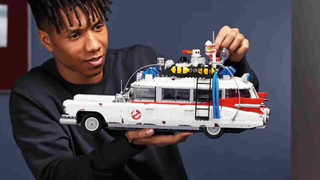 An adult with their LEGO Icons Ghostbusters ECTO-1