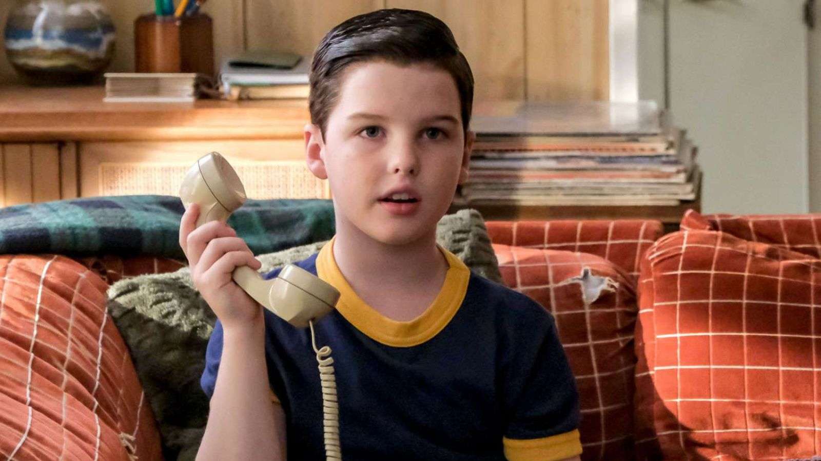 Sheldon holding a phone in Young Sheldon
