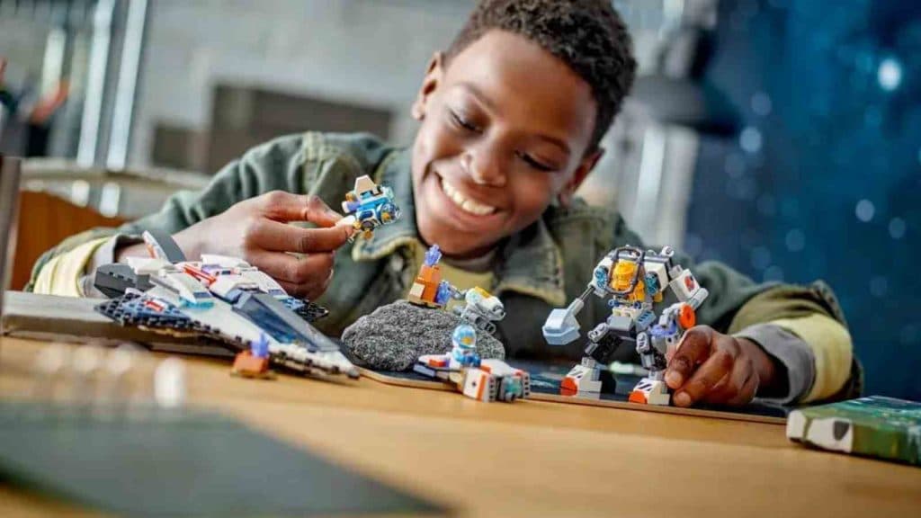 A child playing with the LEGO City Space Explorers Pack