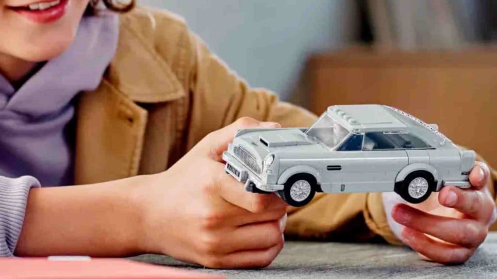 A child with their LEGO Speed Champions 007 Aston Martin DB5