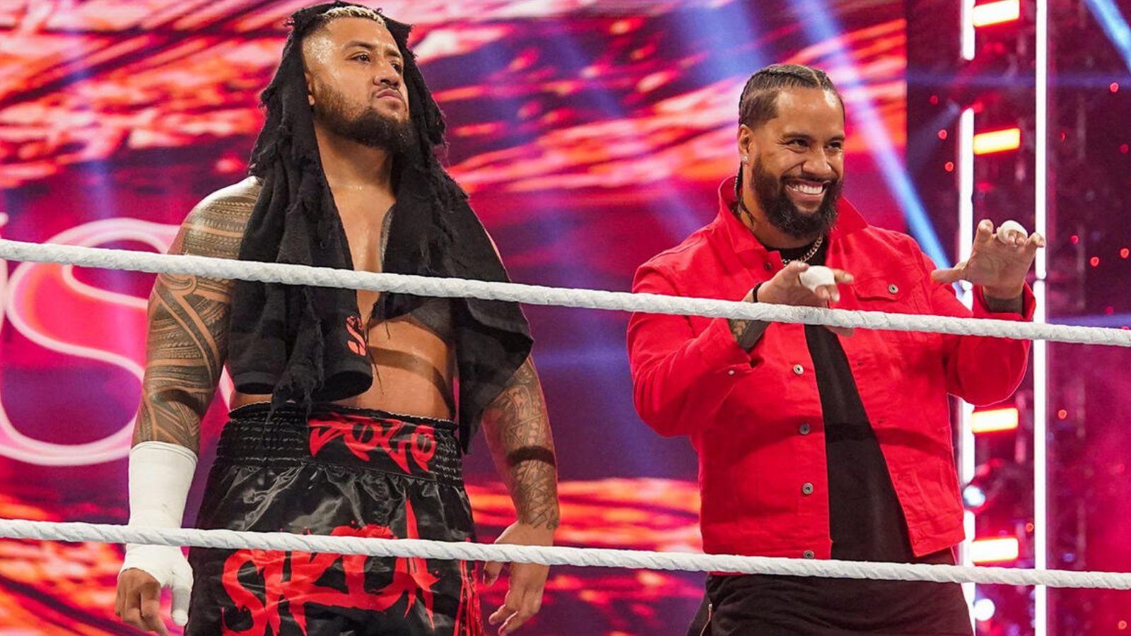 Solo Sikoa (left) and Jimmy Uso (right) ringside as WWE superstars.