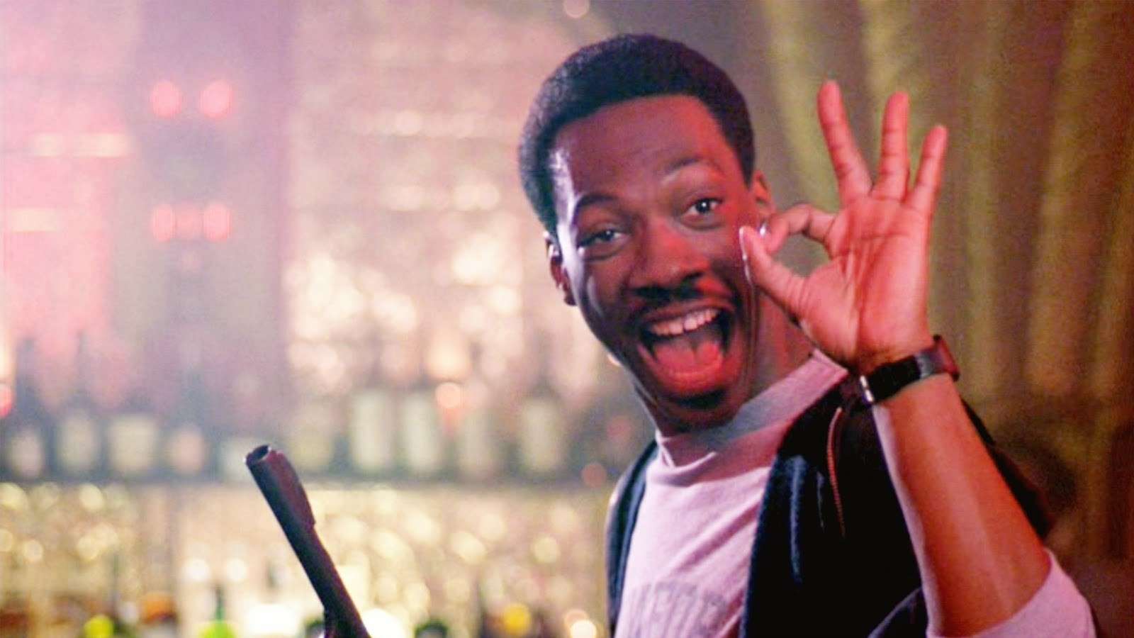 Eddie Murphy as Axel Foley in Beverly Hills Cop, giving the thumbs up