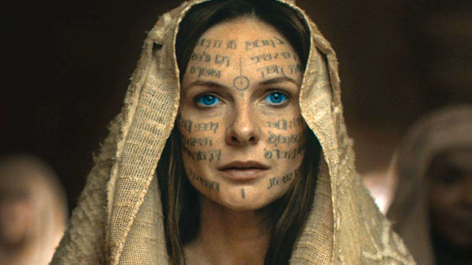 Rebecca Ferguson as Lady Jessica in Dune 2, with writing across her face