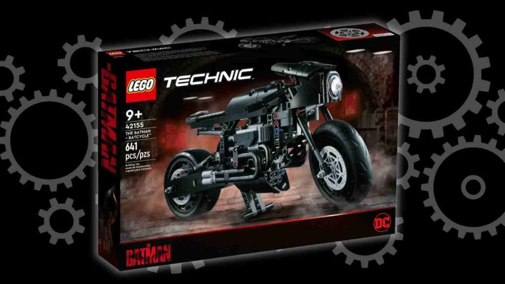 The LEGO-reimagined Batcycle on a black background with a graphic of gears