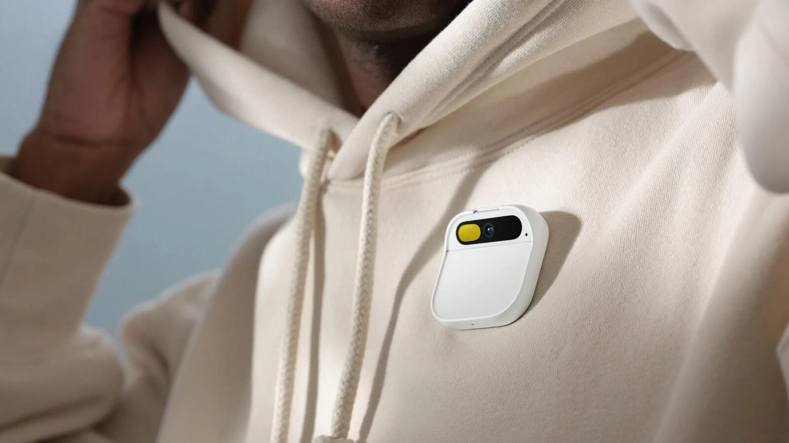 Image showing the Humane AI Pin attached to a user's jacket.